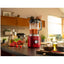 KitchenAid Pure Power Blender in Empire Red (KSB2072ER) — in use on a kitchen counter