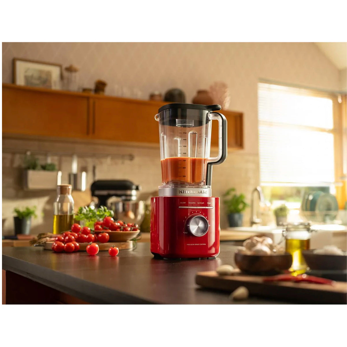 KitchenAid Pure Power Blender in Empire Red (KSB2072ER) — in use on a kitchen counter
