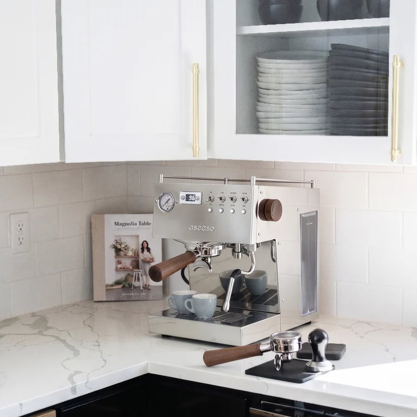 Ascaso Steel Duo V2.5 PID Dual Thermoblock Espresso Machine in inox stainless steel, on a marble kitchen counter with cups and a tamper