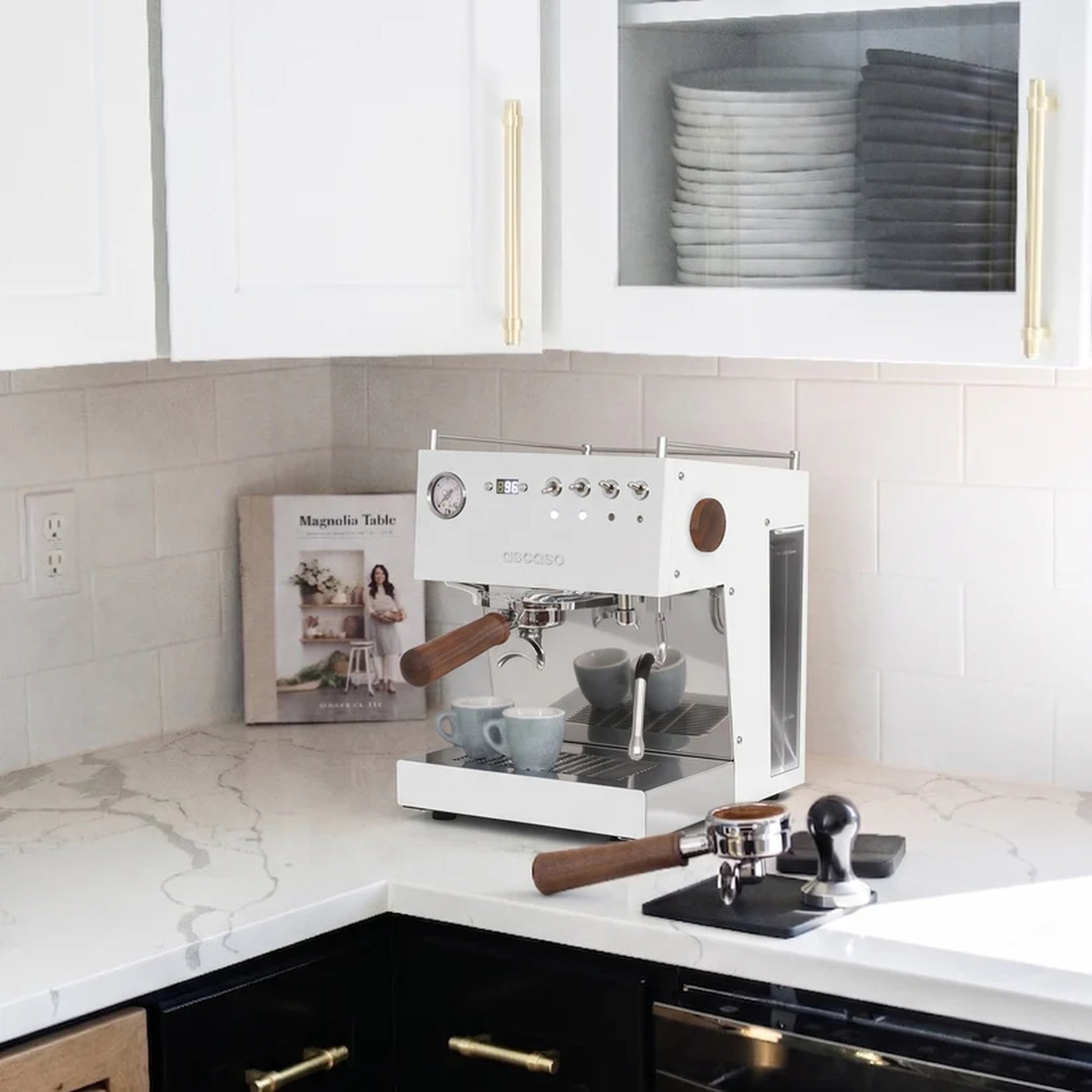Ascaso Steel Duo V2.5 PID Dual Thermoblock Espresso Machine in white, on a marble kitchen counter with cups and a tamper