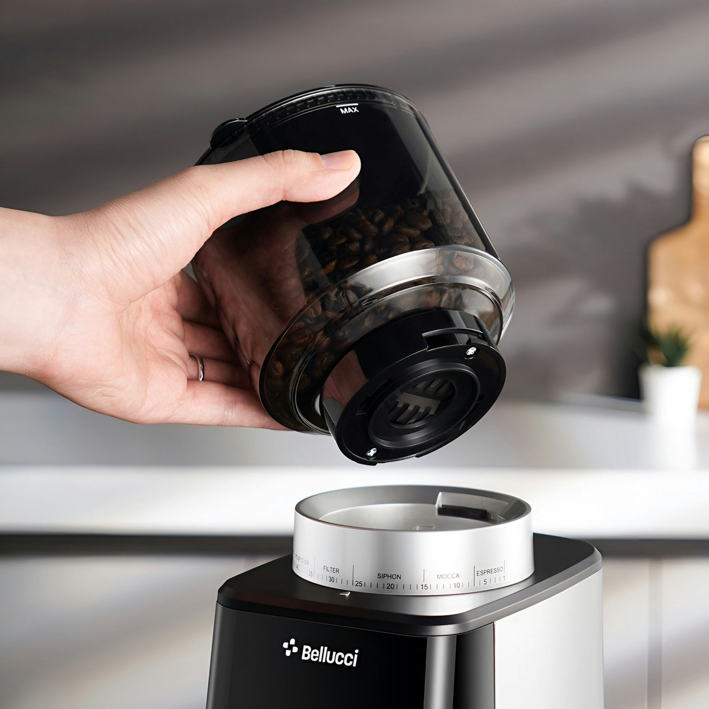 Bellucci Casa Coffee Grinder in black, removing the bean hopper