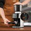 Bellucci Casa Coffee Grinder in black, in use on a kitchen counter