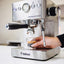 Bellucci Espresso Bar Semi-Automatic Espresso Machine in stainless steel, pulling an espresso shot