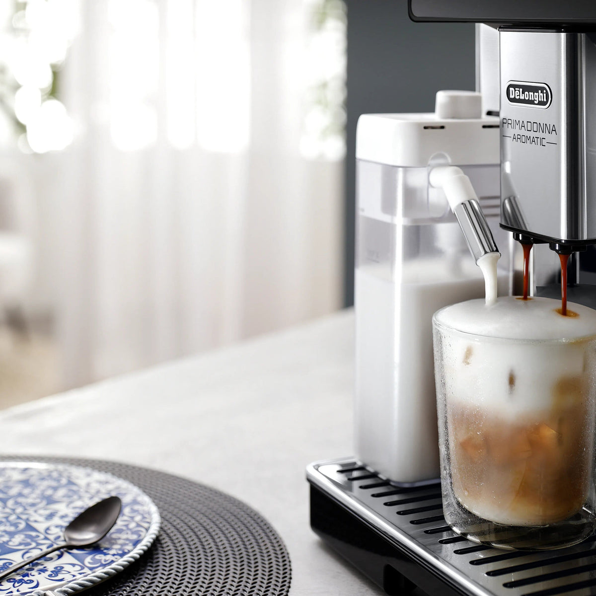 De'Longhi LatteCrema Cool Upgrade Set for Rivelia, cold foam dispensing into a glass