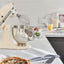 KitchenAid Artisan Series 5-Quart Tilt-Head Stand Mixer in almond cream, on a kitchen counter beside a freshly baked tart