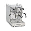 La Pavoni Mini Cellini X espresso machine in polished stainless steel, three-quarter view showing the E61 group and wands
