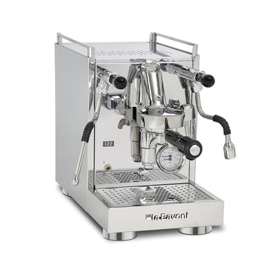 La Pavoni Mini Cellini X espresso machine in polished stainless steel, three-quarter view showing the E61 group and wands