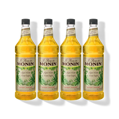 Four 1L plastic bottles of Monin Organic Agave Nectar in a row