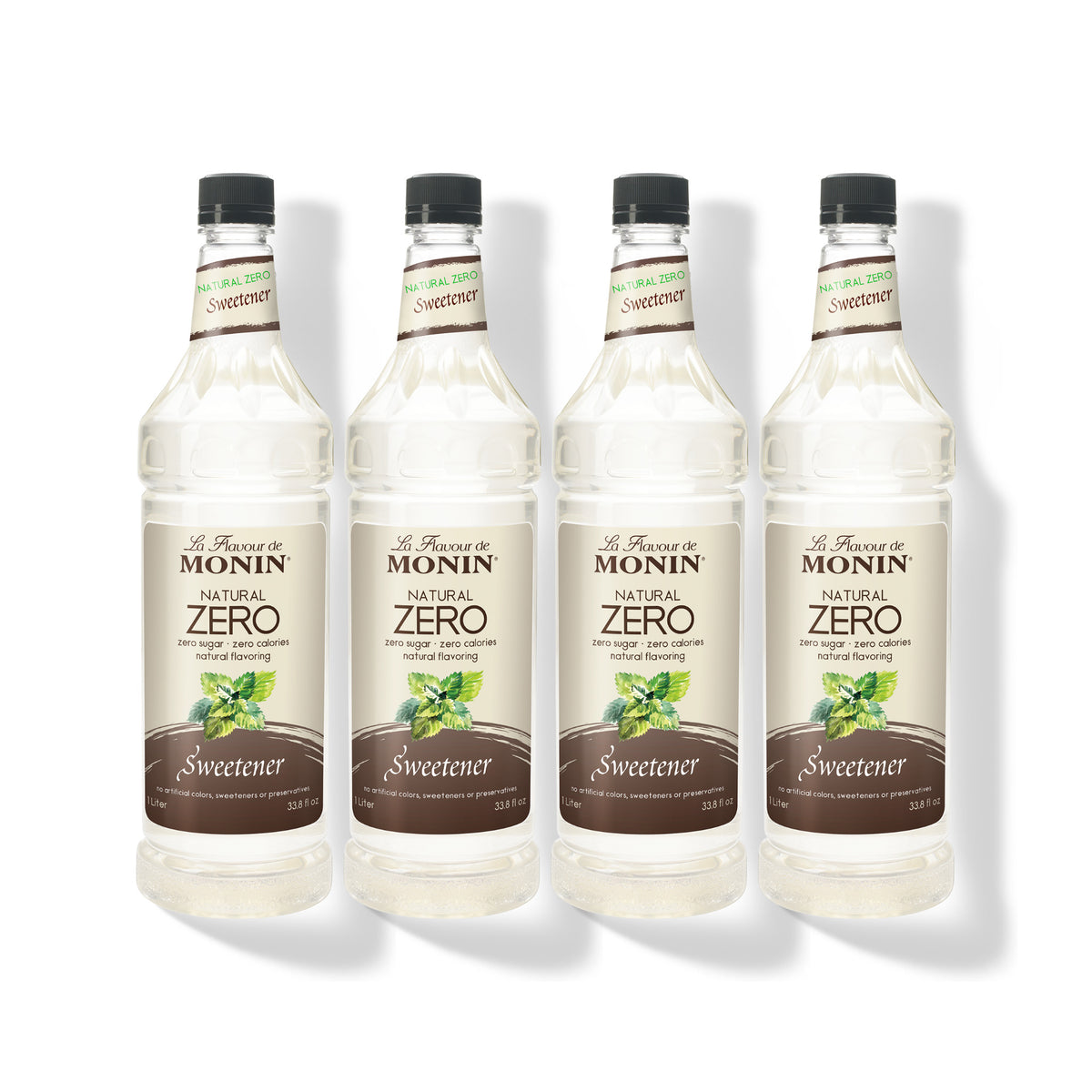 Four 1L plastic bottles of Monin Natural Zero Sweetener in a row