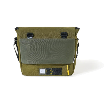 OutIn Flex Messenger Bag in cypress green, rear view with the mesh pocket