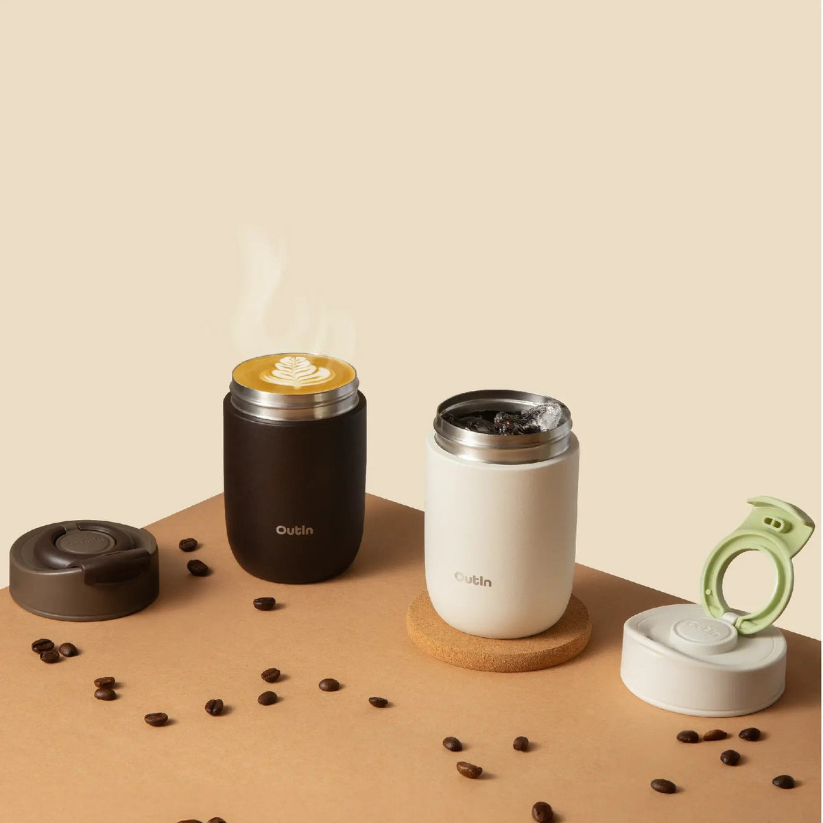 OutIn Travel Tumbler in terra brown, on a table with fresh coffee
