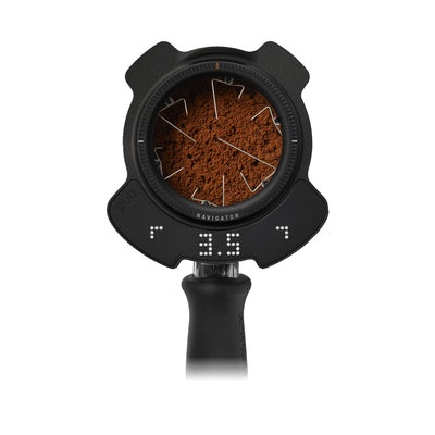 PUQ Prep Navigator in black, mounted on a portafilter with needles in the coffee bed